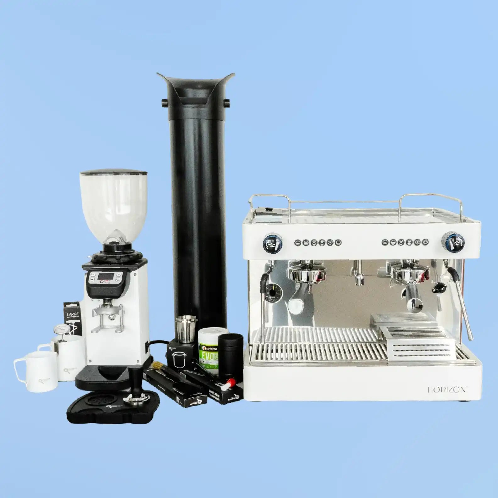 Professional espresso machine setup with grinder and accessories.