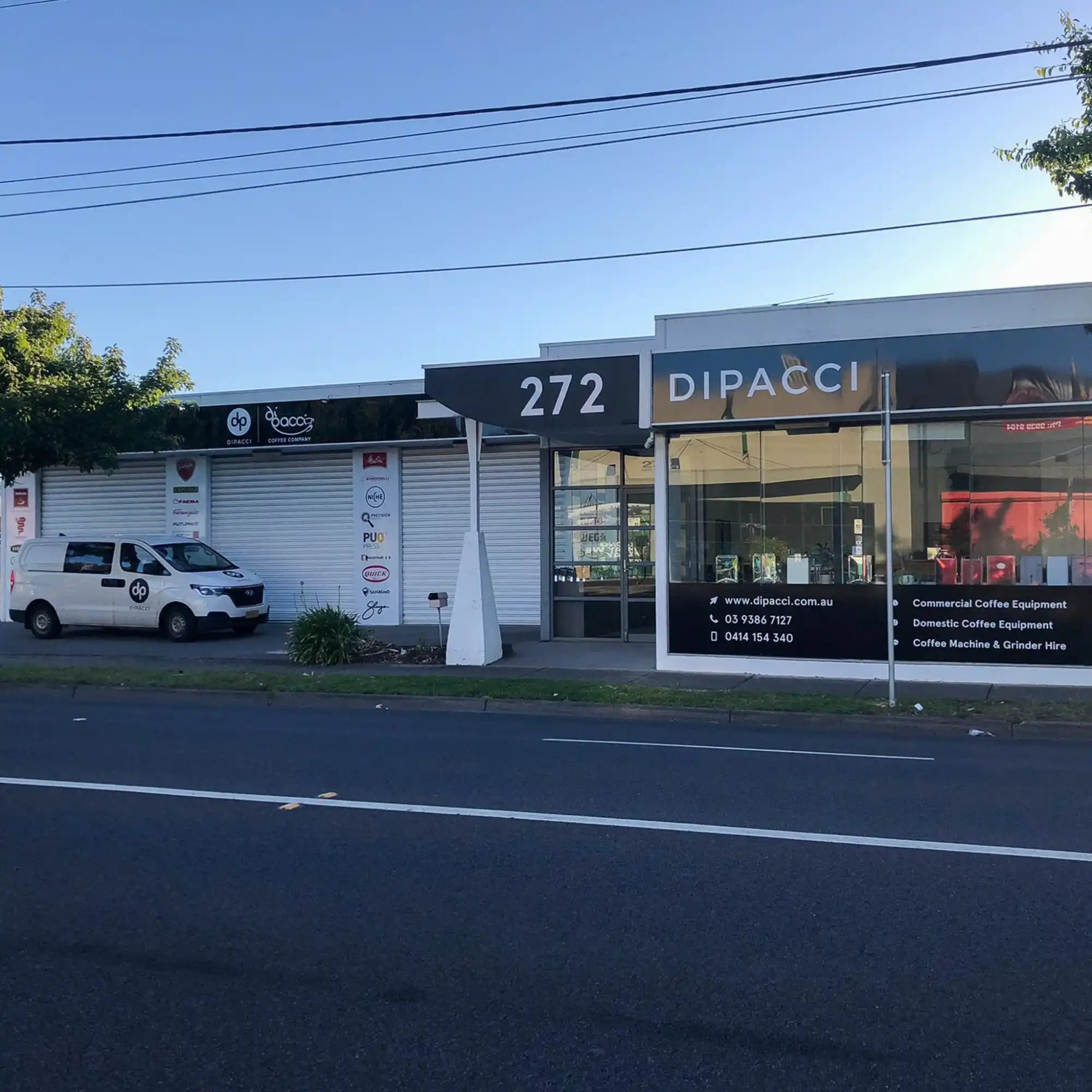 Storefront with ’272 DIPACCI’ signage on a commercial building.